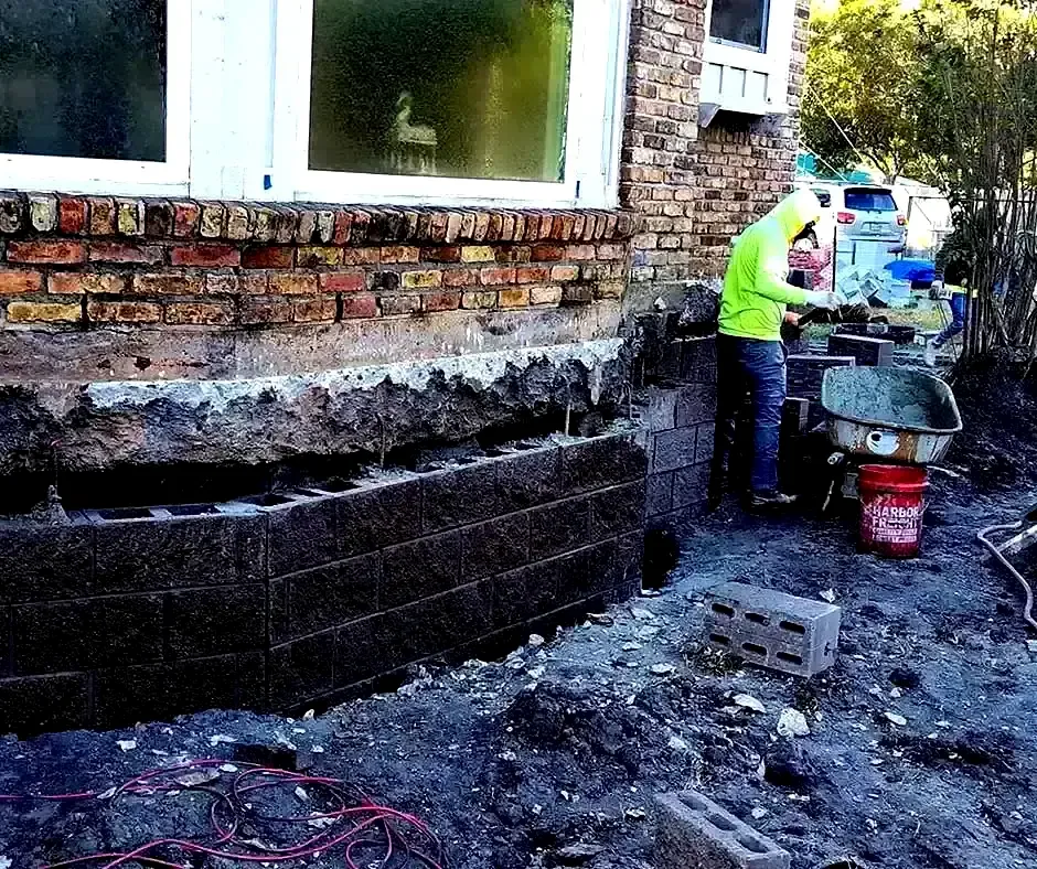 Worker rebuilding Foundation Repair Boston, MA Worker rebuilding Foundation Repair Boston, MA